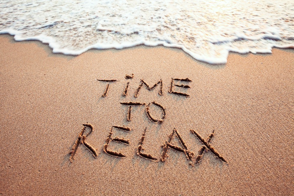 A beach with the words time to relax written in it.